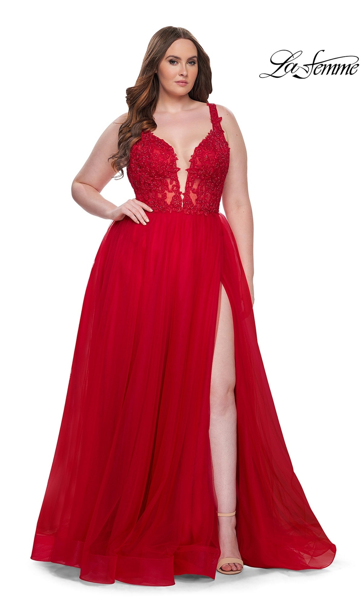 A woman models the La Femme Long Prom Dress 31394—a sleeveless, floor-length red gown with an embroidered lace bodice and thigh-high slit—against a white background. She wears nude heels. The